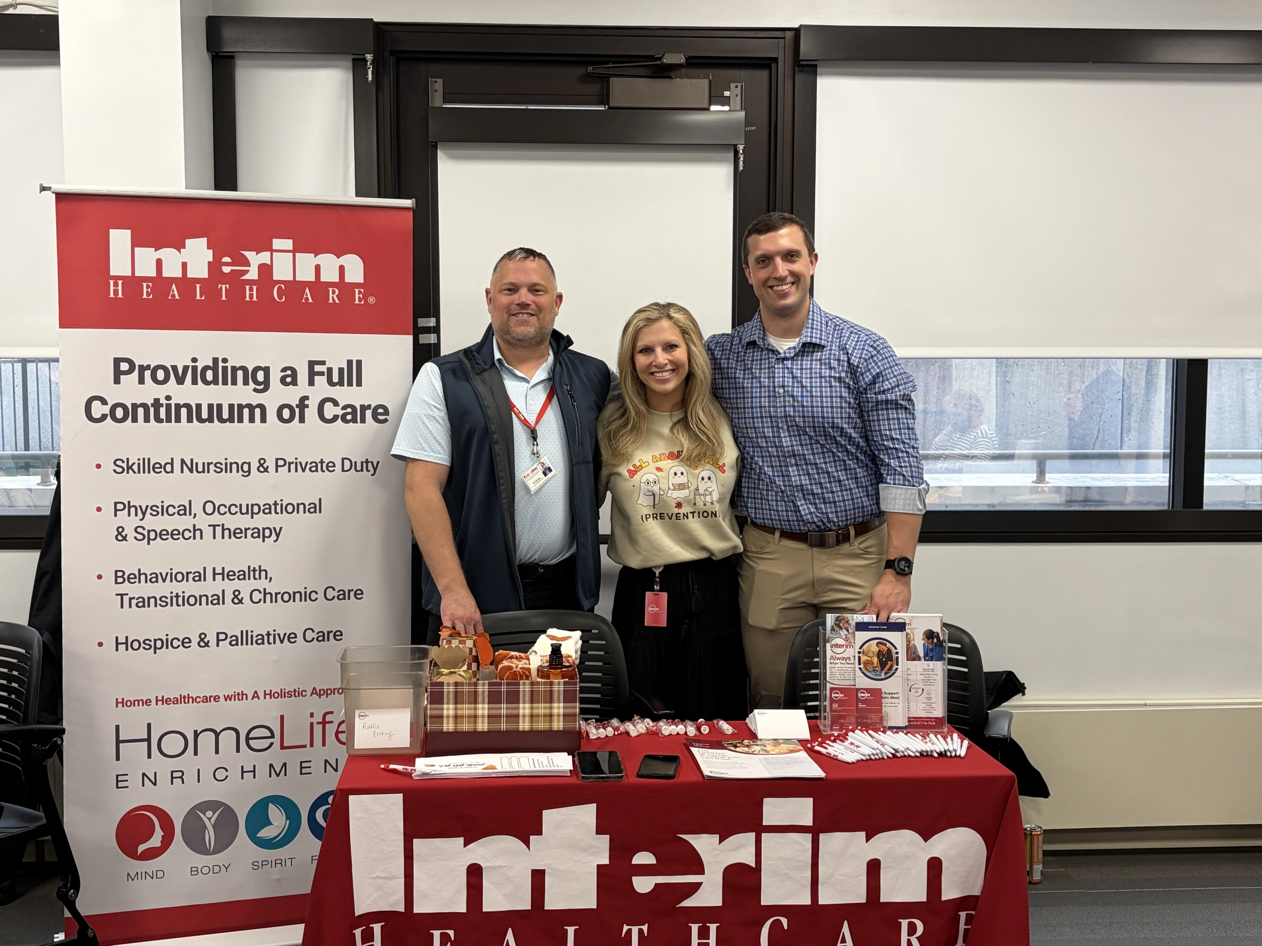 Reps at vendor table at MFB fair