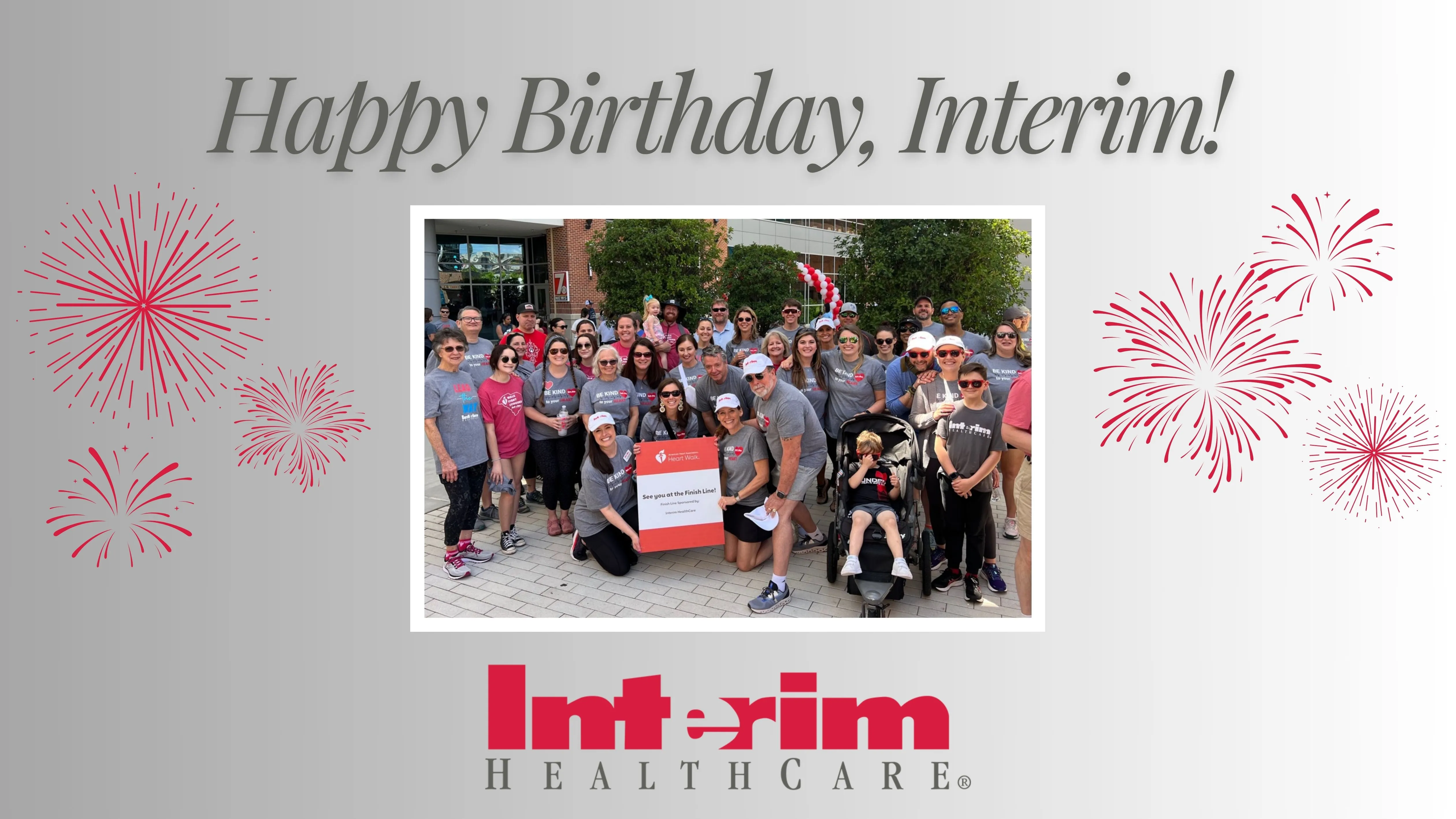 A group of Interim staff poses together on a graphic that says "Happy Birthday, Interim!"